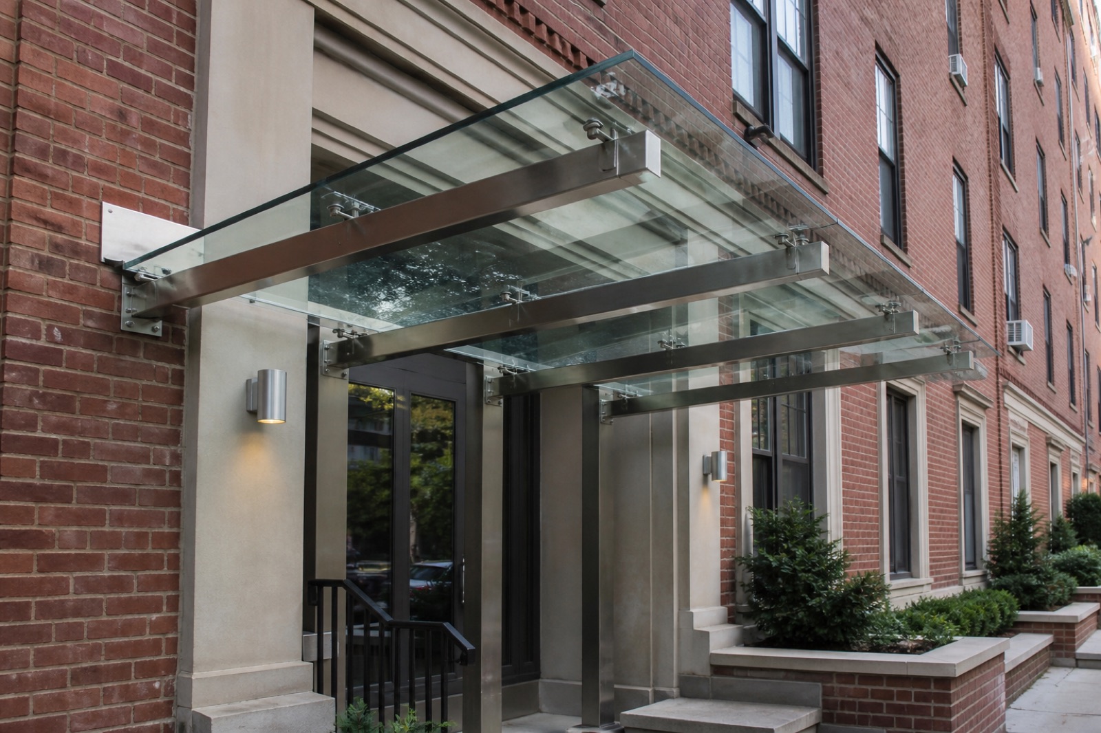 Stainless Steel Glass Canopy — Multifamily entrance reference